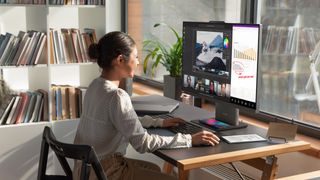 Lenovo's ThinkCentre Neo 50a and wireless charging stand in situ