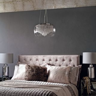 Low hanging pendant lights in gray bedroom