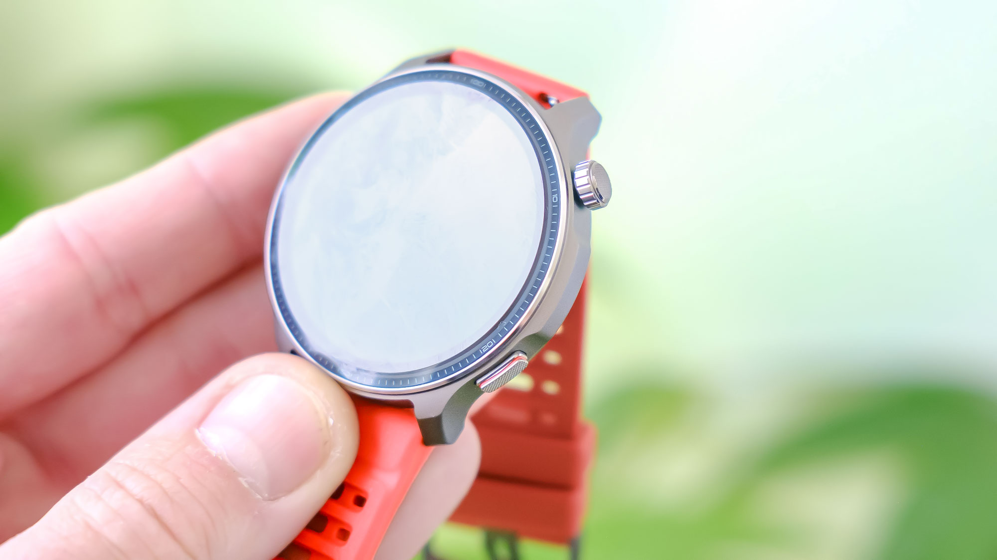 Close-up of the Amazfit Balance 2 smartwatch on an orange rubber strap