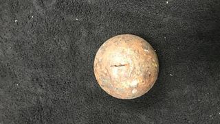 Workers at the recycling center found the cannonball on the processing line.