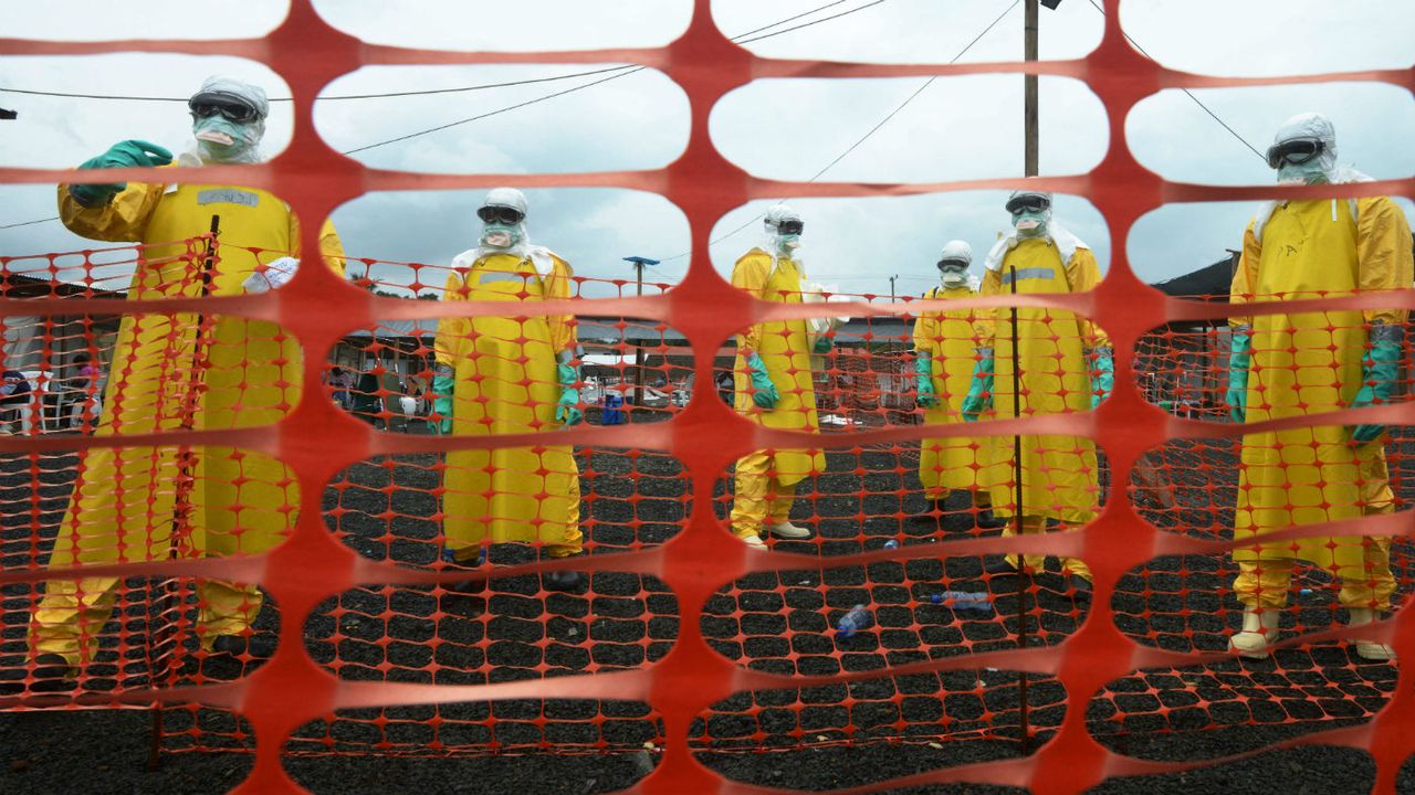 Health workers wearing protective clothing during the Ebola outbreak in Liberia in 2014