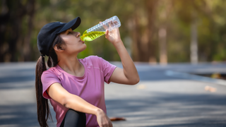 Woman drinking water with electrolytes