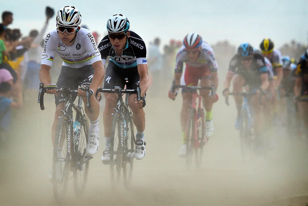 Michal Kwiatkowski drives the pace over the cobbles.