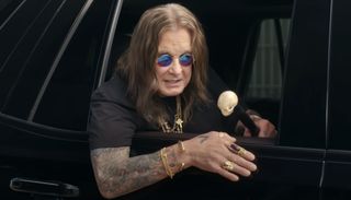 Ozzy Osbourne leans out of a car window in a Liquid Death ad