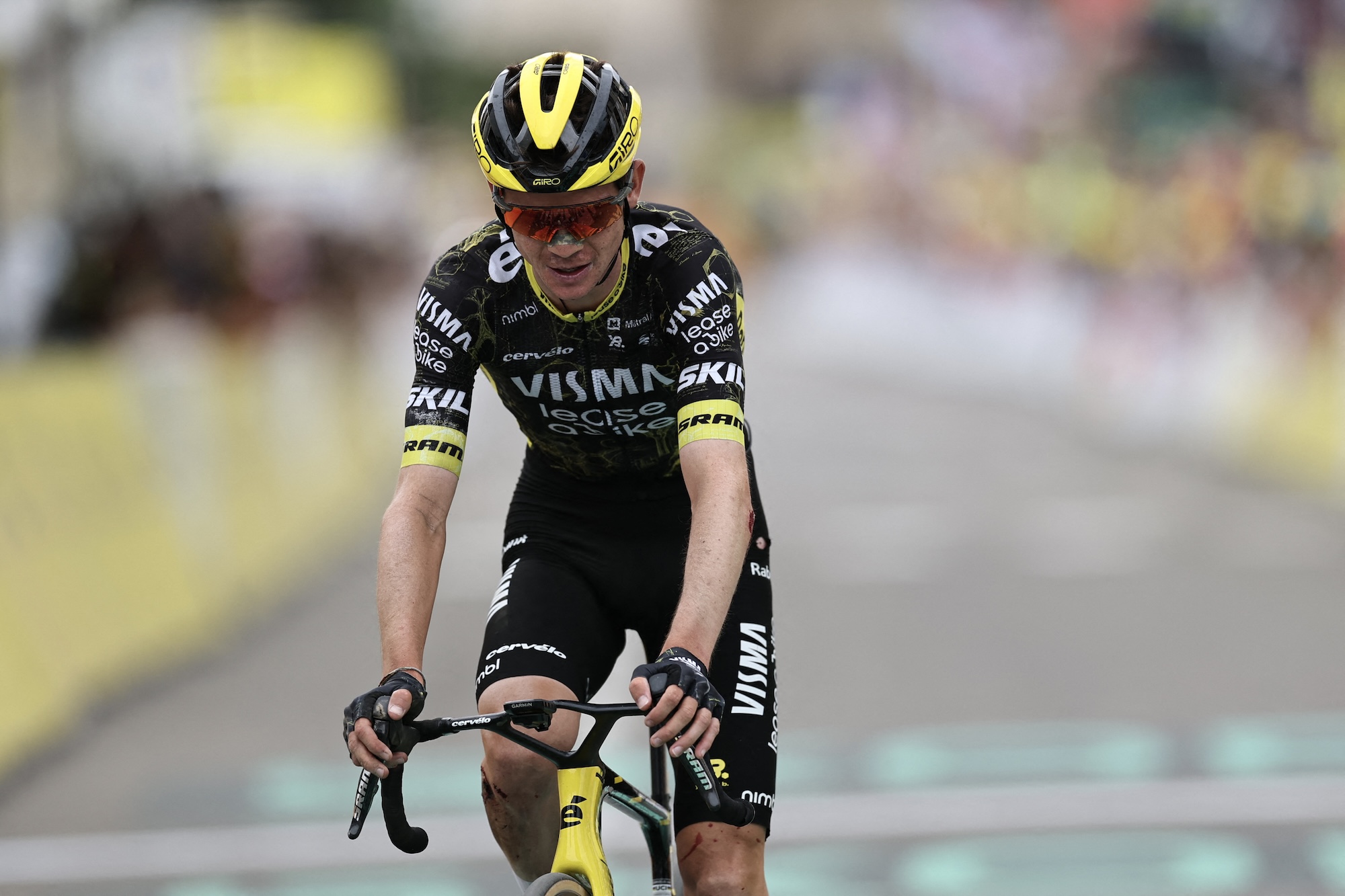 Sepp Kuss (Visma-Lease a Bike) makes it to the finish line of stage 20 in third place after crashing twice in final 10km