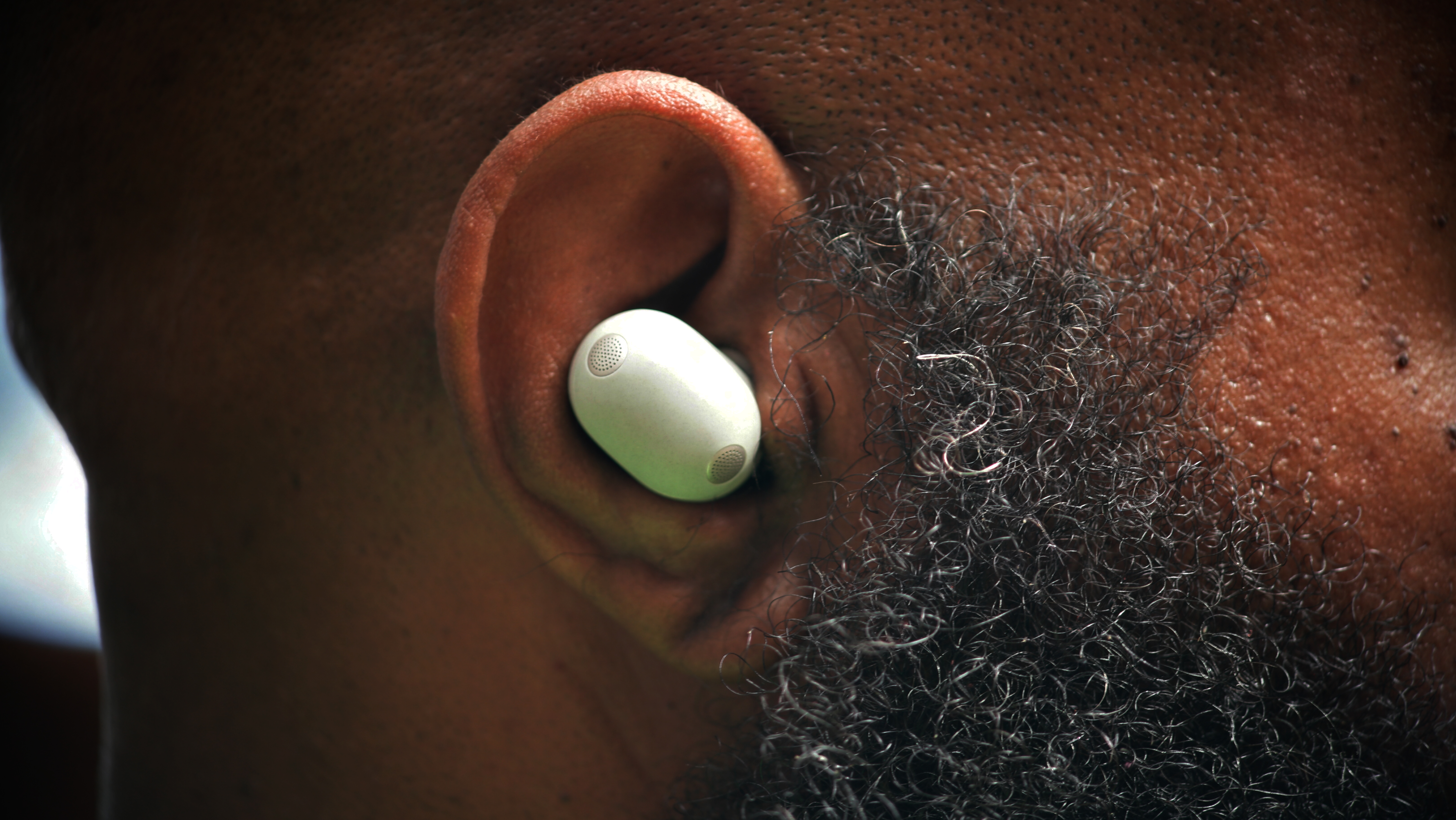 Sony WF-1000XM6 headphones are worn by the reviewer