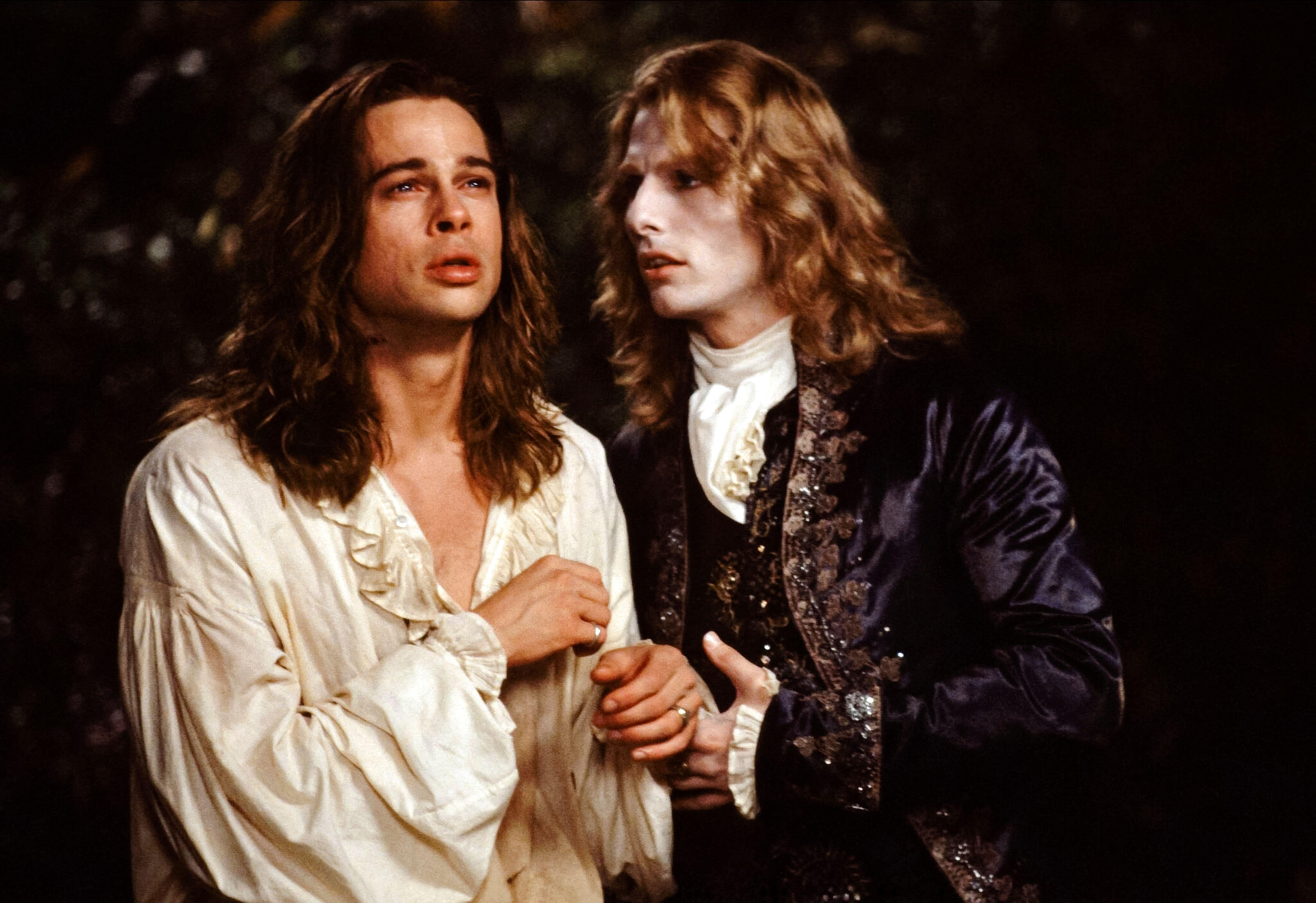 Brad Pitt and Tom Cruise as two vampires with long hair and in victorian era clothing in 'Interview With the Vampire'