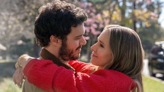 Adam Brody and Kristen Bell holding each other and looking longingly into each other's eyes.