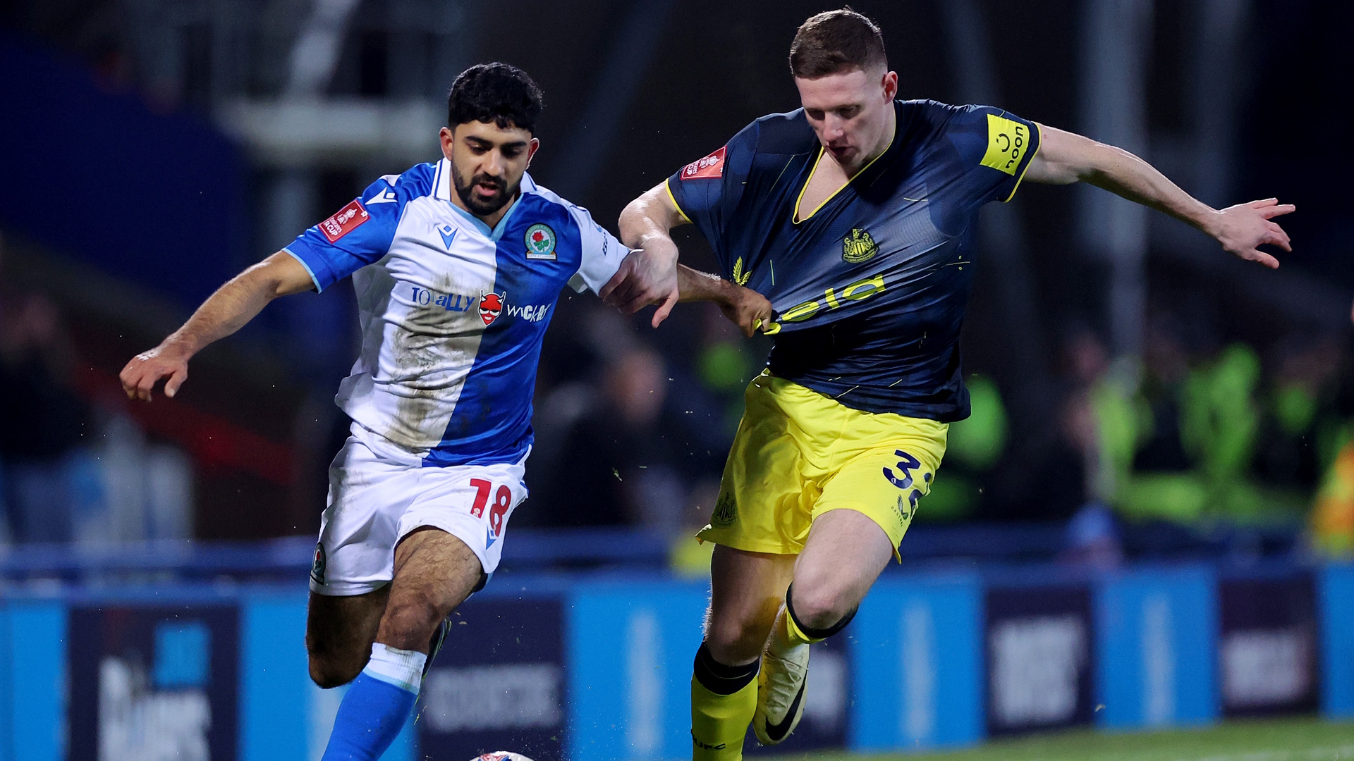 Dilan Markanday of Blackburn Rovers and Elliot Anderson of Newcastle United battle for possession during an FA Cup soccer match.