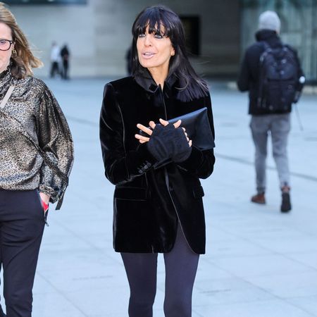 Claudia Winkleman steps out in London wearing dark grey leggings with dark brown fringed monk shoes and a velvet jacket.