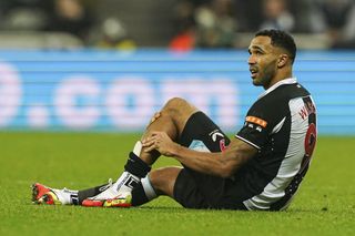 Newcastle United’s Callum Wilson on the ground holding his leg because of an injury during the Premier League match at St. James’ Park, Newcastle.