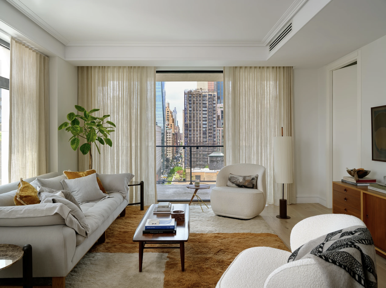 A living room with orange hues dispersed evenly throughout the room