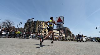 Lemi Berhanu Hayle leads the 2016 Boston Marathon through Kenmore Square, approaching the Citgo sign