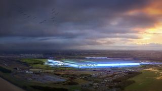An arial shot of a proposed EV battery gigafactory in Northumberland, UK, showing a Britishvolt brand banner lit in neon blue