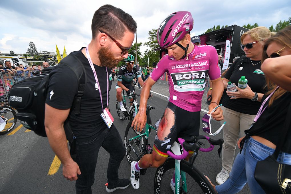 Pascal Ackermann shows the damage from his stage 10 crash in the Giro