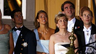 Wedding of Princess Martha Louise and Ari Behn in Trondheim, Norway on May 24, 2002 - Martha Louise and Ari Behn with their guest at the balcony for looking a firework, left to rigth: X, Karl Philip and Madeleine of Sweden, Prince Nikolaos of Greece, Sophie Rhys Jones and prince Edward.