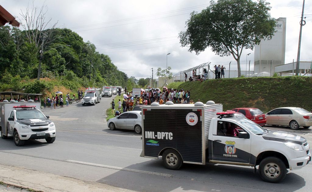 Vans of the Legal Medicine Institute (IML) carrying bodies of inmates killed during a riot.