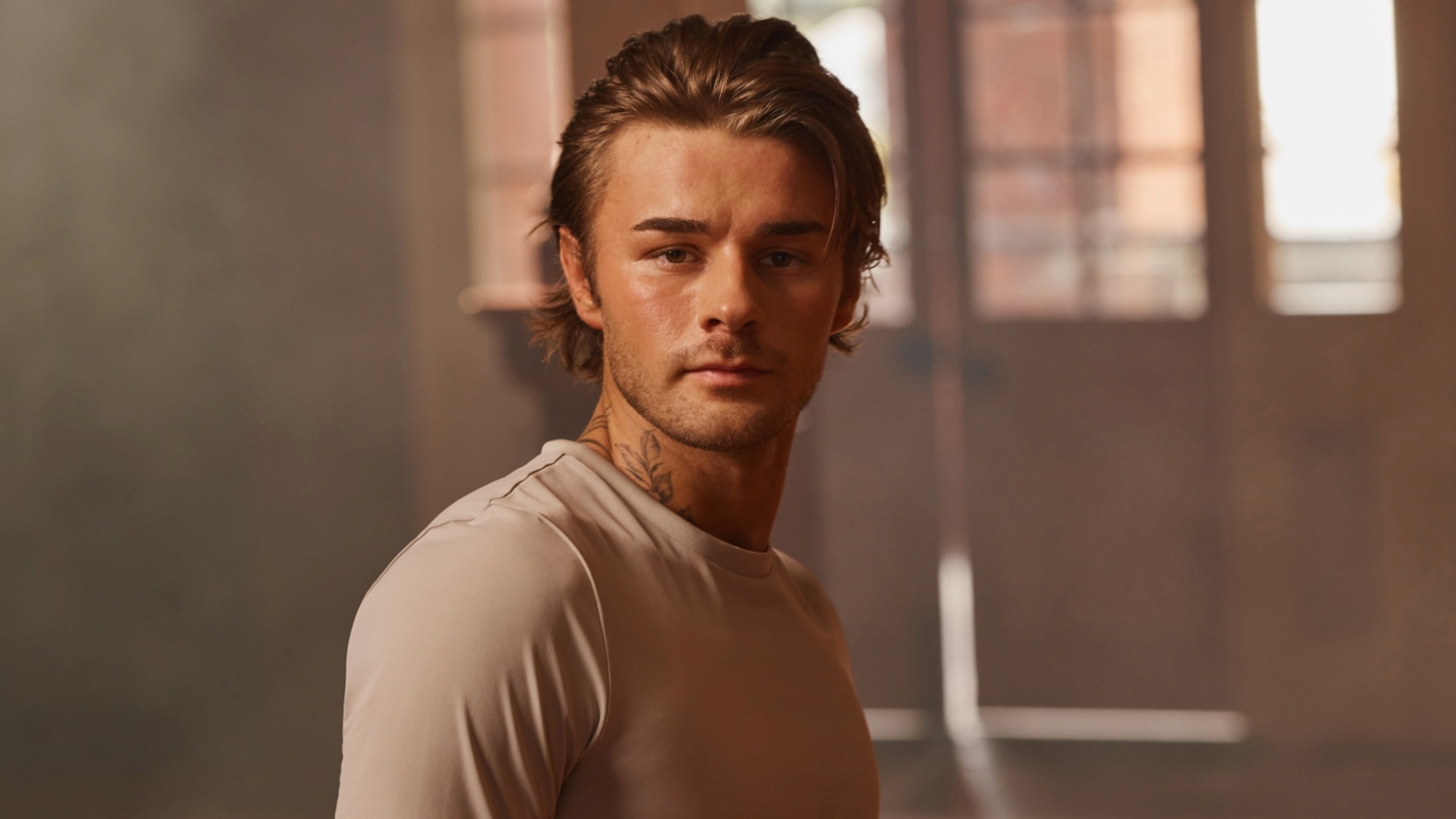 Dancing with the Stars: The Next Pro dance contestant Erik Linder looking directly into the camera in a promo gallery photo.