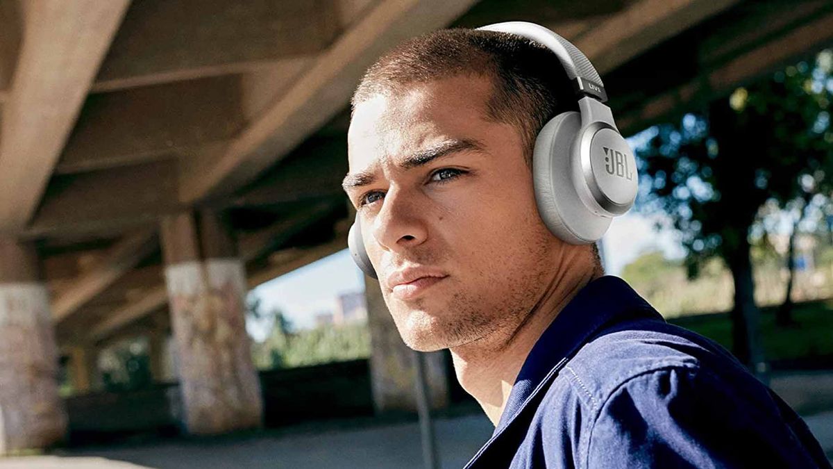 JBL Live 660NC headphones on man&#039;s head.