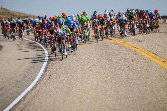 The bunch descends before the days KOM climb.