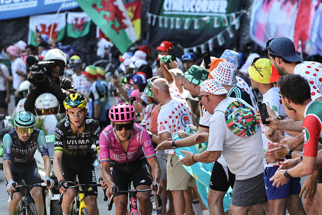 EF Education - EasyPost team's Ecuadorian rider Richard Carapaz, Team Visma | Lease a Bike's US rider Sepp Kuss and Bahrain - Victorious team's French rider Lenny Martinez cycle in the lead breakaway in the Alpe d'Huez ascent during the 19th stage of the 113th edition of the Tour de France cycling race, 127,9 km between Gap and Alpe d'Huez in the French Alps, on July 24, 2026. (Photo by Anne-Christine POUJOULAT / AFP)