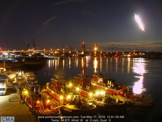 A dazzling fireball lights up the night sky over the Piscataqua River in Portsmouth, New Hampshire on May 17, 2016 in this stunning still image captured by a camera with Portsmouthwebcam.com and provided by Mike McCormack. The meteor was widely visible ac