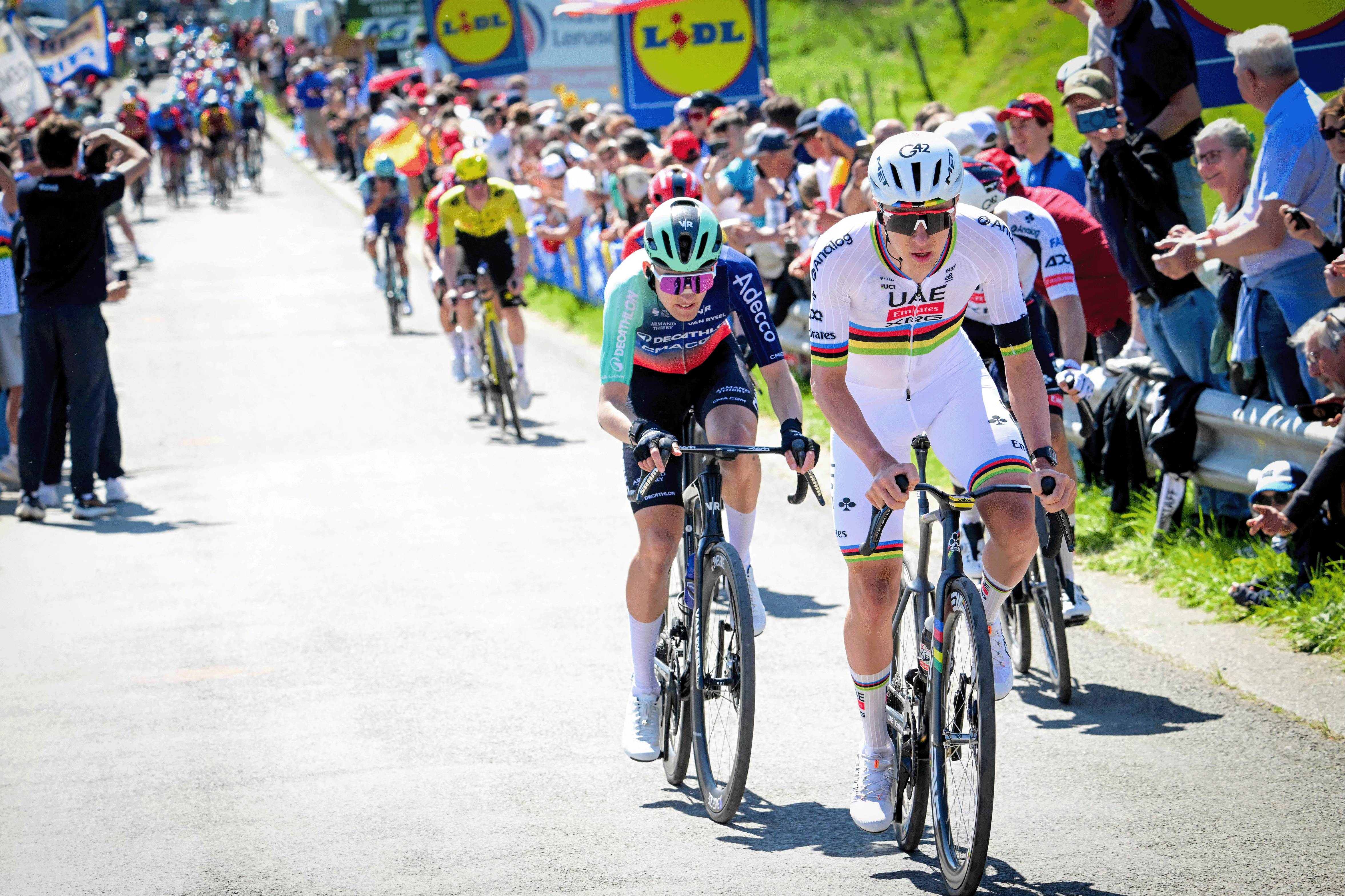 UAE Team Emirates-XRG's Slovenian rider Tadej Pogacar (R) and Decathlon CMA-CGM Team's French rider Paul Seixas cycle during the men elite race of the Liege-Bastogne-Liege UCI World Tour one day cycling race, 259.5km from Liege, over Bastogne to Liege, on April 26, 2026. (Photo by Bernard PAPON / various sources / AFP via Getty Images) / Belgium OUT