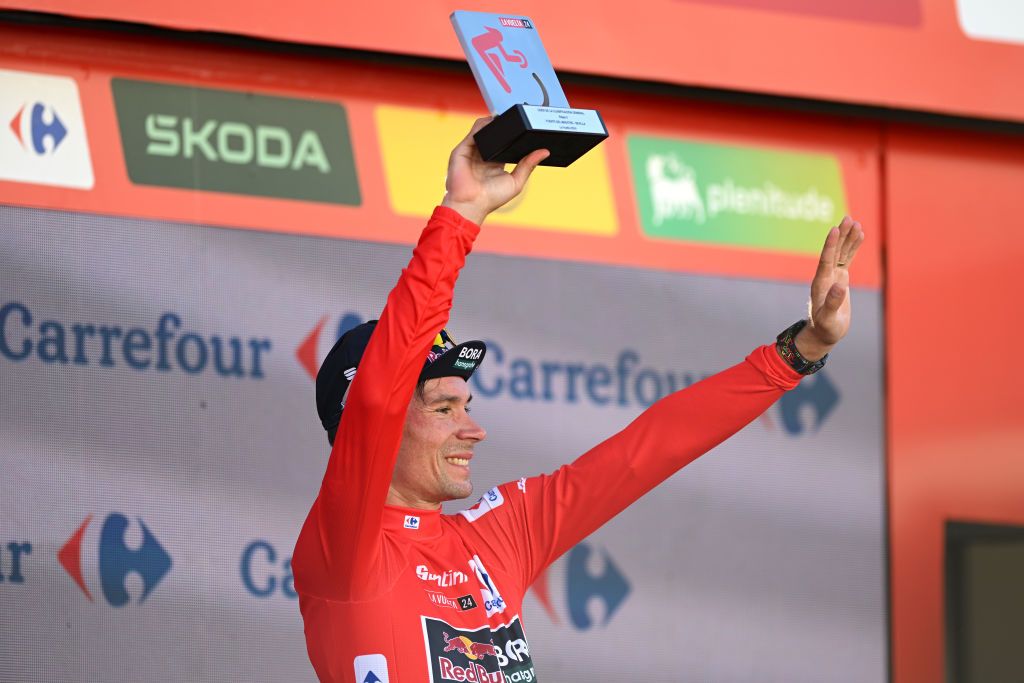 SEVILLE SPAIN AUGUST 21 Primoz Roglic of Slovenia and Team Red Bull Bora hansgrohe Red Leader Jersey celebrates at podium during La Vuelta 79th Tour of Spain 2024 Stage 5 a 177km stage Fuente del Maestre to Seville UCIWT on August 21 2024 in Seville Spain Photo by Dario BelingheriGetty Images