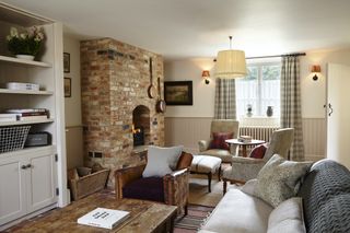 exposed brick fireplace in country living room