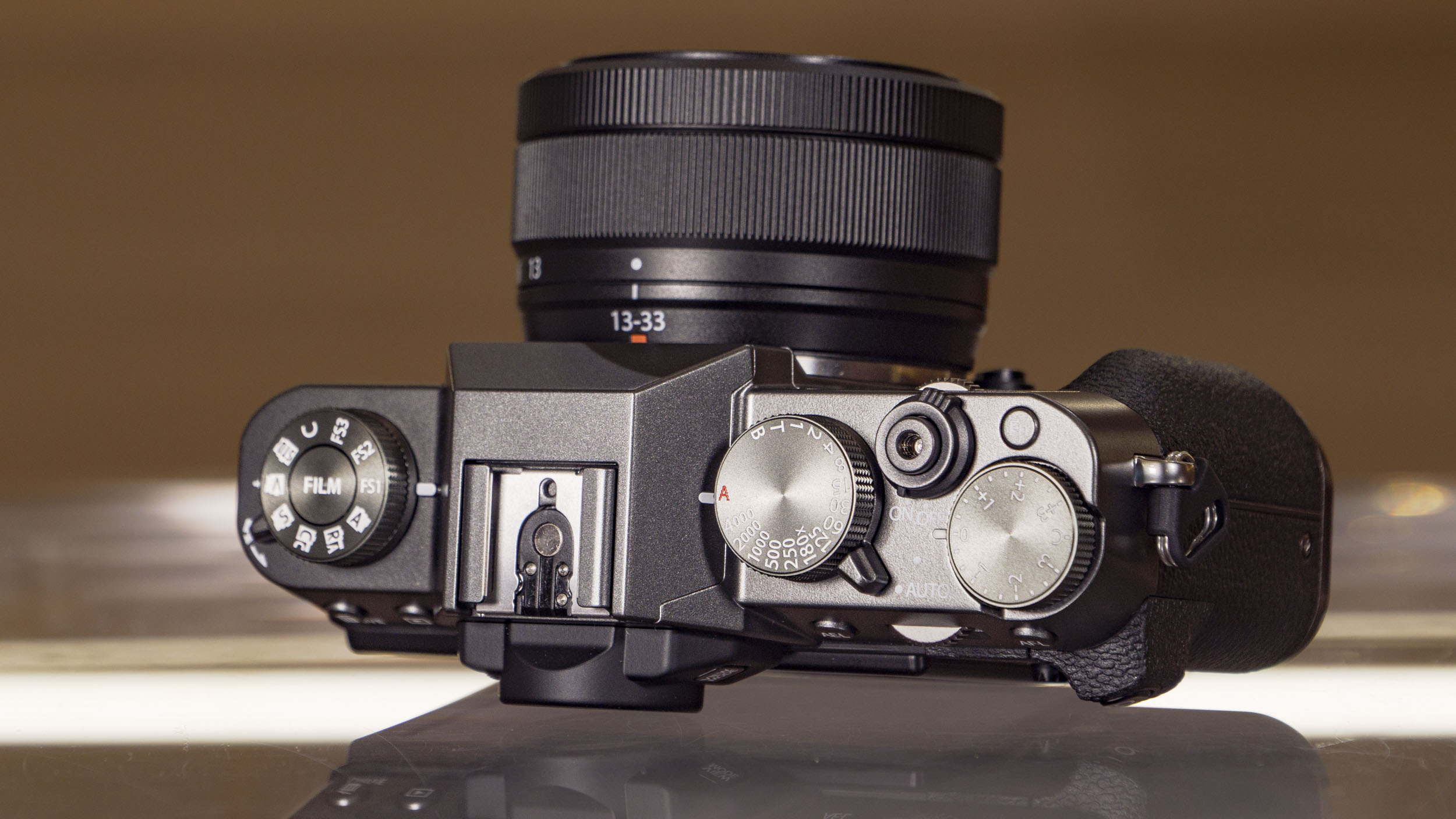 Fujifilm X-T30 III camera on a glass table