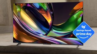 A Hisense-brand TV displaying colorful, abstract imagery in a large, empty space