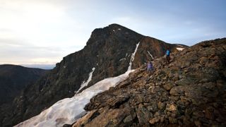 Hikers descent Mount of the Holy Cross