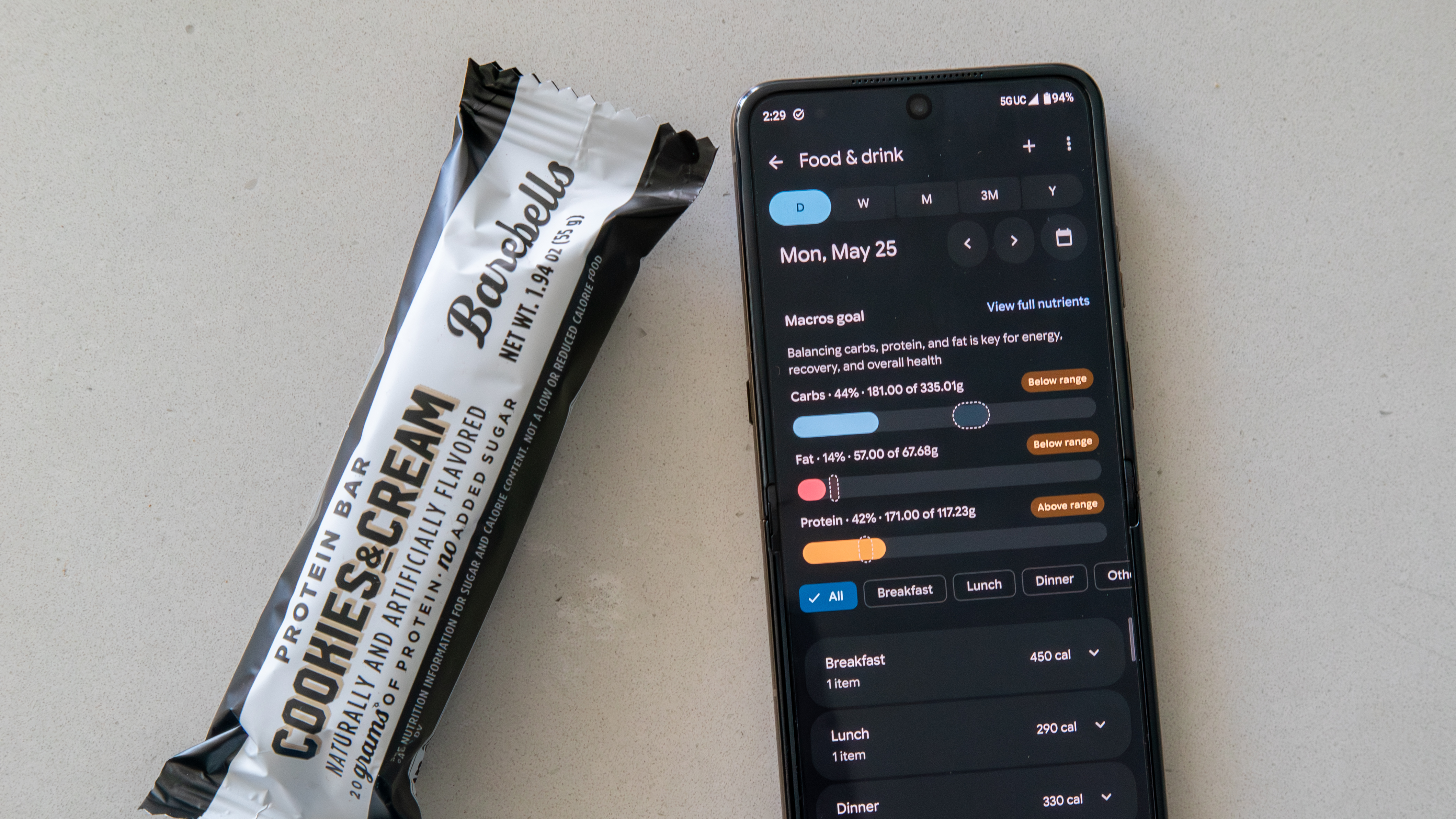 Google Health app food log and a protein bar