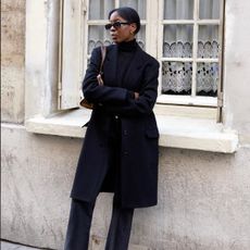 An image of @sylviemus_ wearing cigarette trousers.