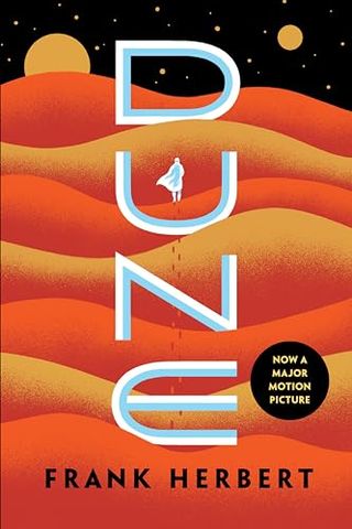 Dune book cover featuring orange and yellow sand dunes in outer space with planets in the background