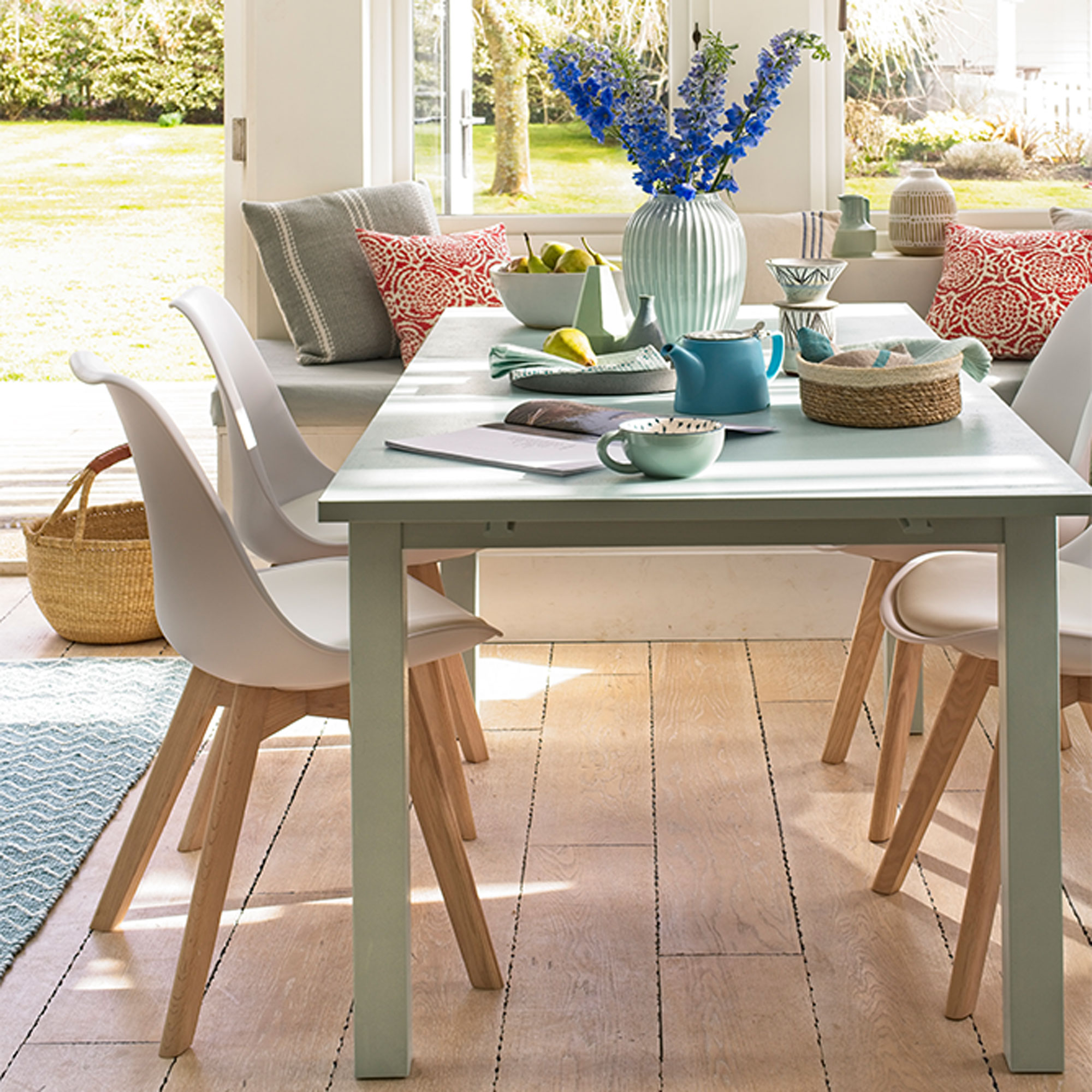 dining table with flower pot and tea pot