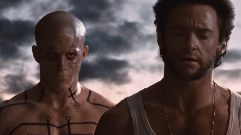 A mute Wade Wilson stands behind Logan in X-Men Origins: Wolverine