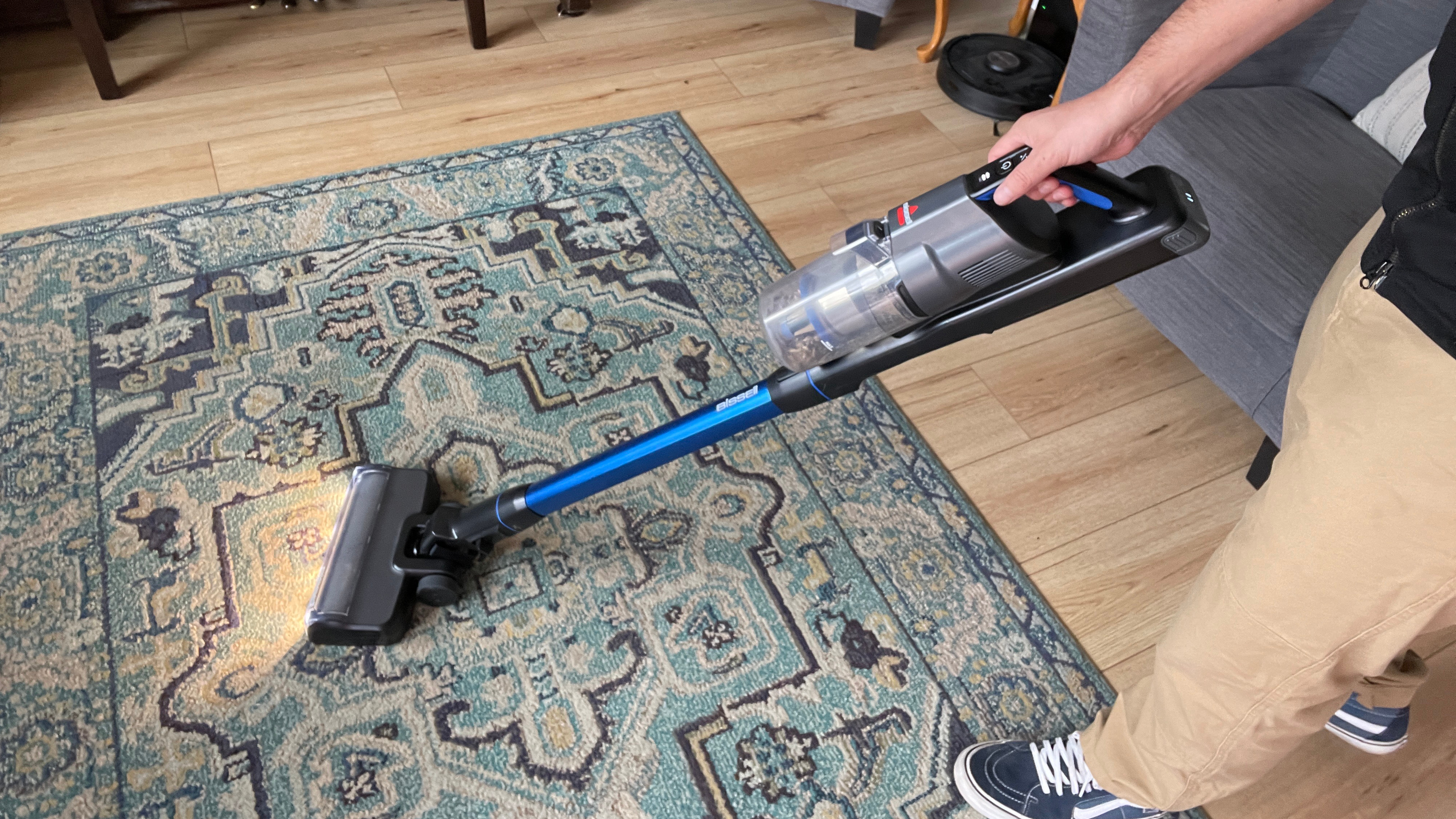Bissell PowerClean FurFinder Cordless Stick Vacuum on blue patterned rug