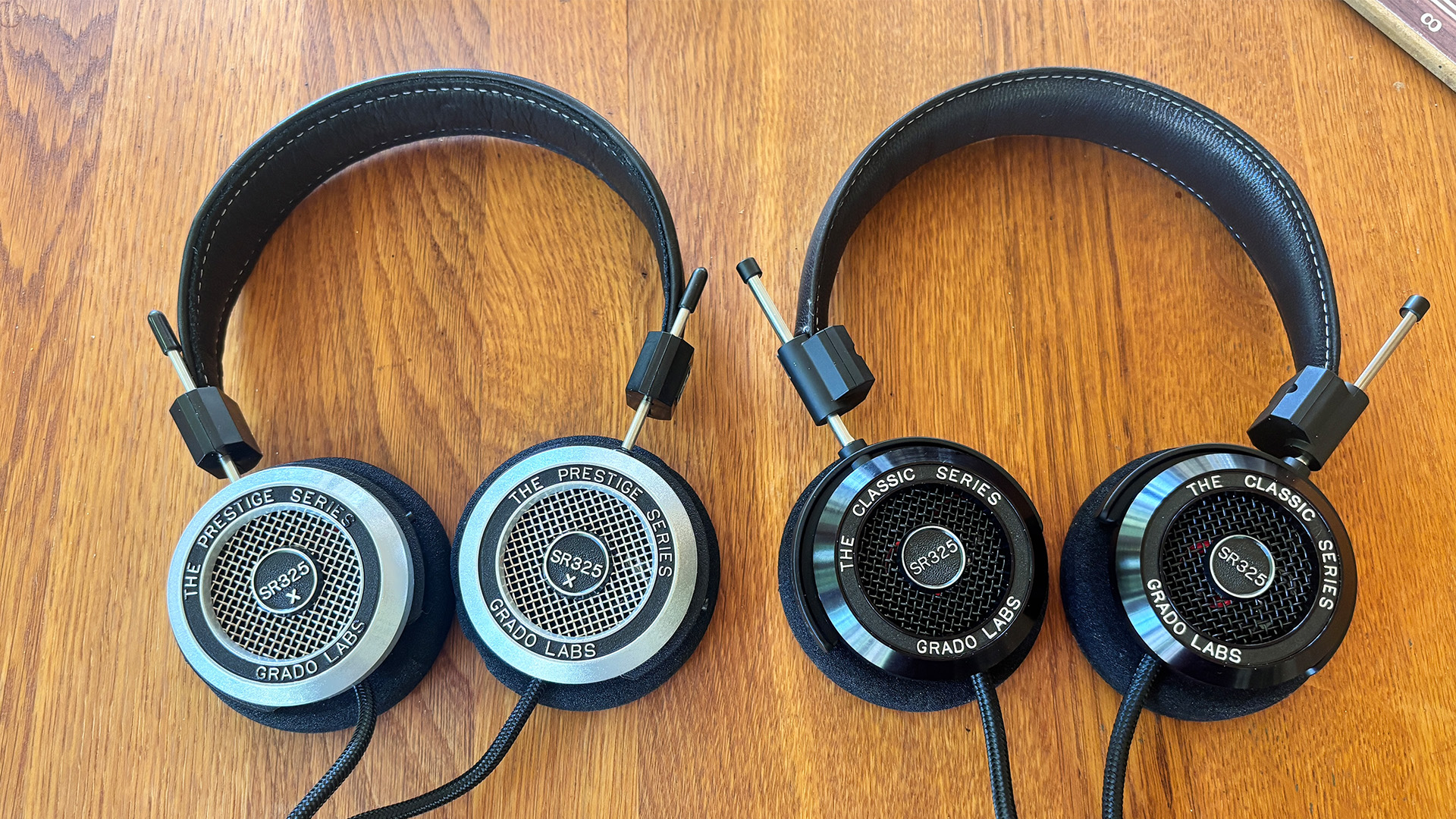 Grado SR325 Classic over-ear headphones next to older Grado SR325x headphones