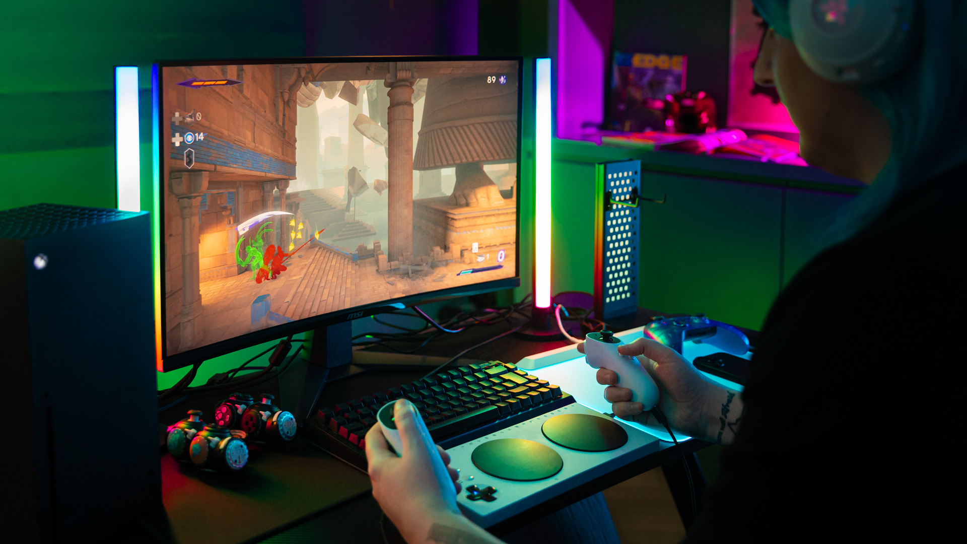 Using the Xbox Accessibility Controller on a PC with colourful lighting behind the monitor