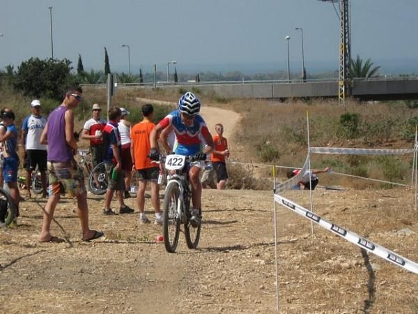 Tanja Zakelj (Slovenia) races toward third.