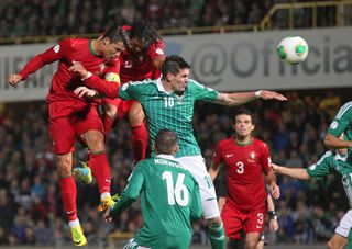 Cristiano Ronaldo (left) scores a header for Portugal against Northern Ireland in September 2013.