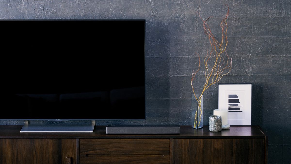 the sony ht-mt300 soundbar next to a TV