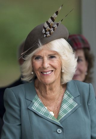 Queen Camilla wore a feathered hat for the Braemar Gathering which has previously divided opinion