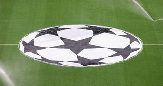 Champions League logo on the pitch during the UEFA Champions League semi-final first leg match between AC Milan and FC Internazionale at San Siro on May 10, 2023 in Milan, Italy.