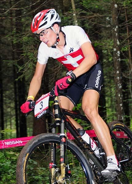 Reto Indergand (Switzerland) rides singletrack.