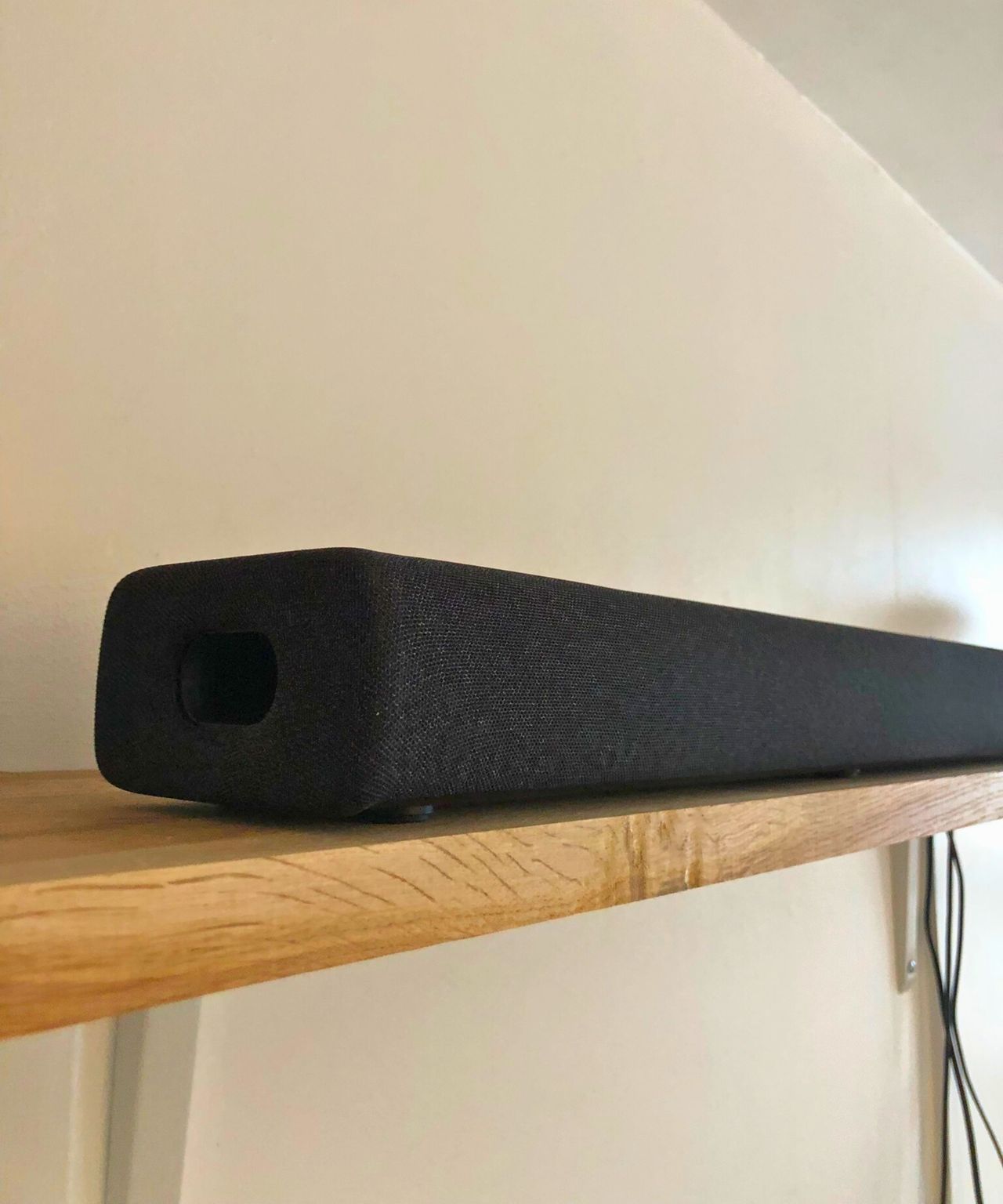 Yamaha True X Bar 40A soundbar on wooden shelf in Dan Fauzi's home.