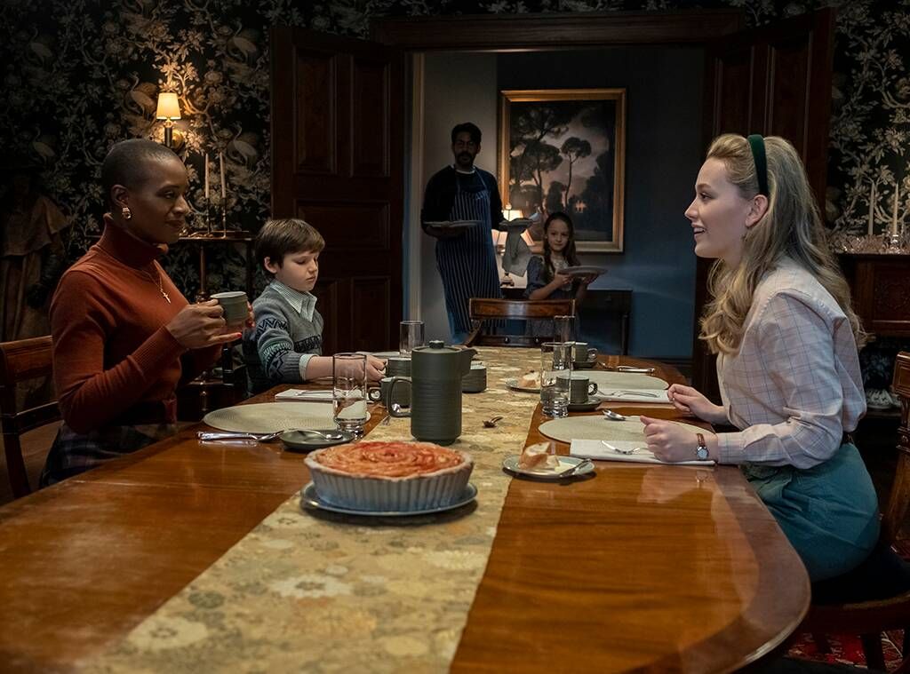 Dani, Hannah, Miles, Flora and Owen all sit down for a meal in &#039;The Haunting of Bly Manor.&#039;