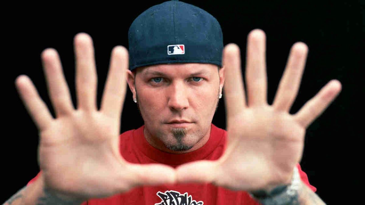 Limp Bizkit’s Fred Durst posing for a photograph in 2002 with his hands spread towards the camera