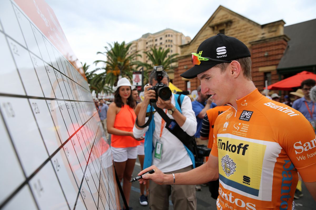 Jay McCarthy signs on for his one stage in the ochre jersey